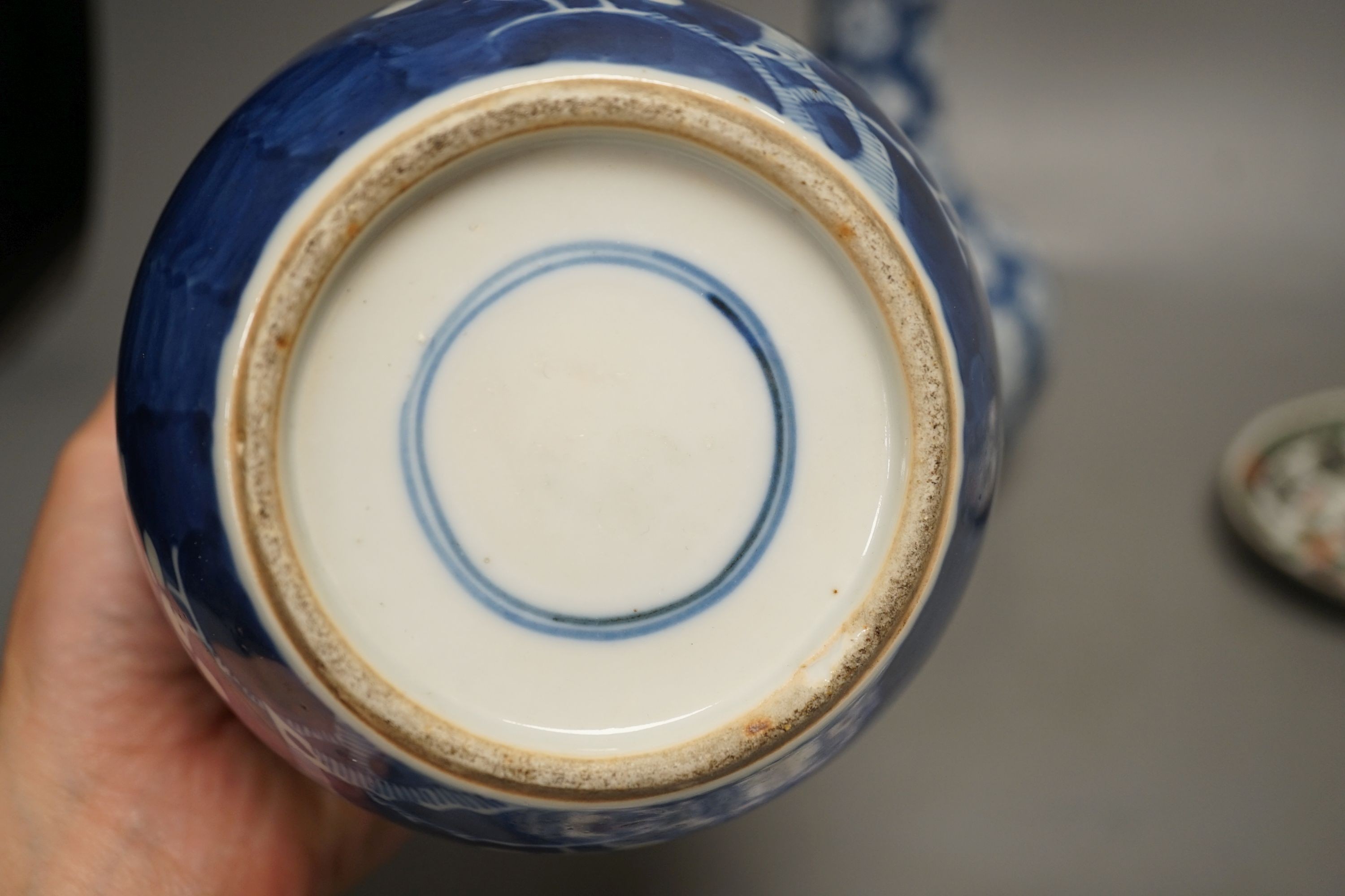 A Chinese blue and white jar, a similar vase, a polychrome plate and a famille verte saucer- plate 25 cms diameter.